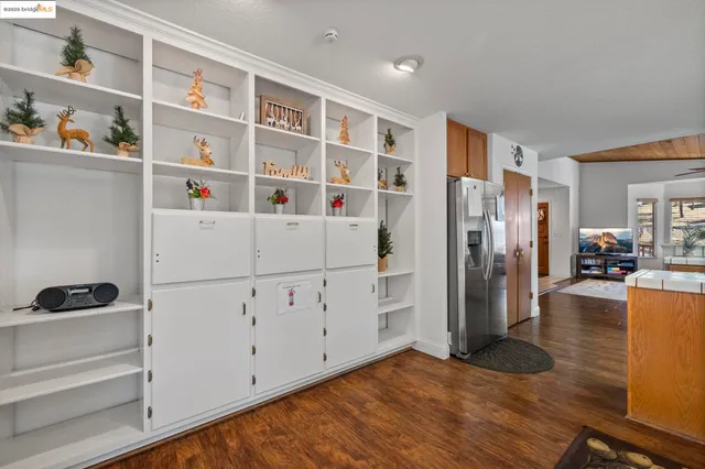 a view of kitchen with furniture and wooden floor