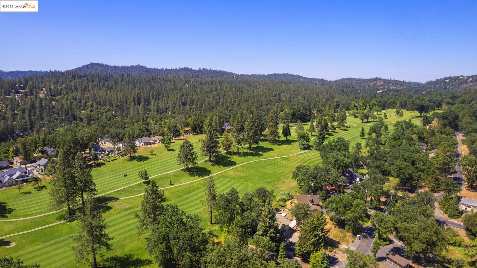 20747 Rising Hill Circle Groveland, CA 95321 - Photo 23 of 60 a view of a lush green hillside and houses