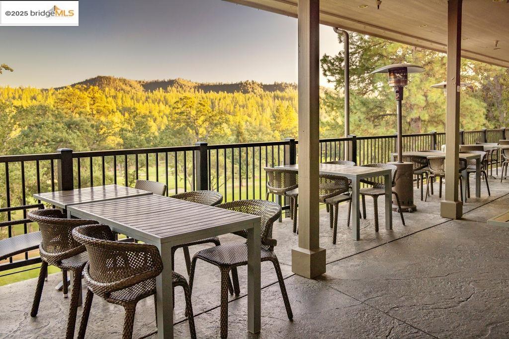 20747 Rising Hill Circle Groveland, CA 95321 - Photo 27 of 60 a view of a balcony dining table and chairs