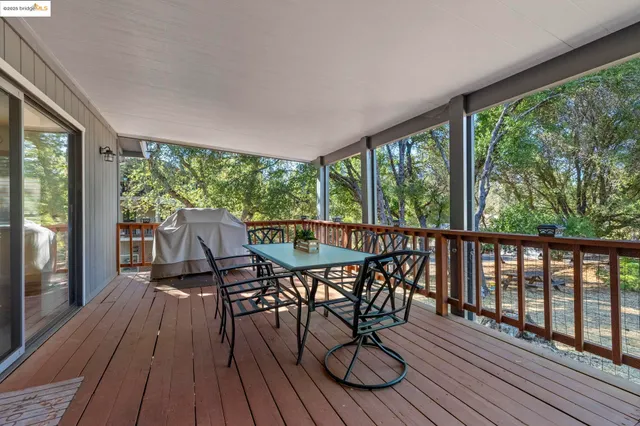 a view of a two chairs in the deck
