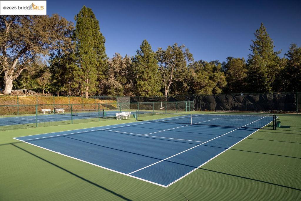 20747 Rising Hill Circle Groveland, CA 95321 - Photo 30 of 60 a view of an outdoor space and tennis court