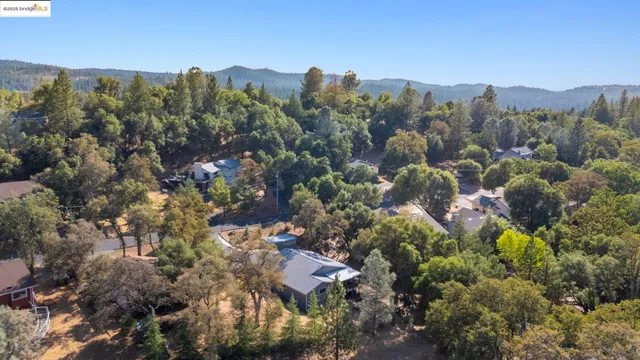 a view of a town with mountains in the background