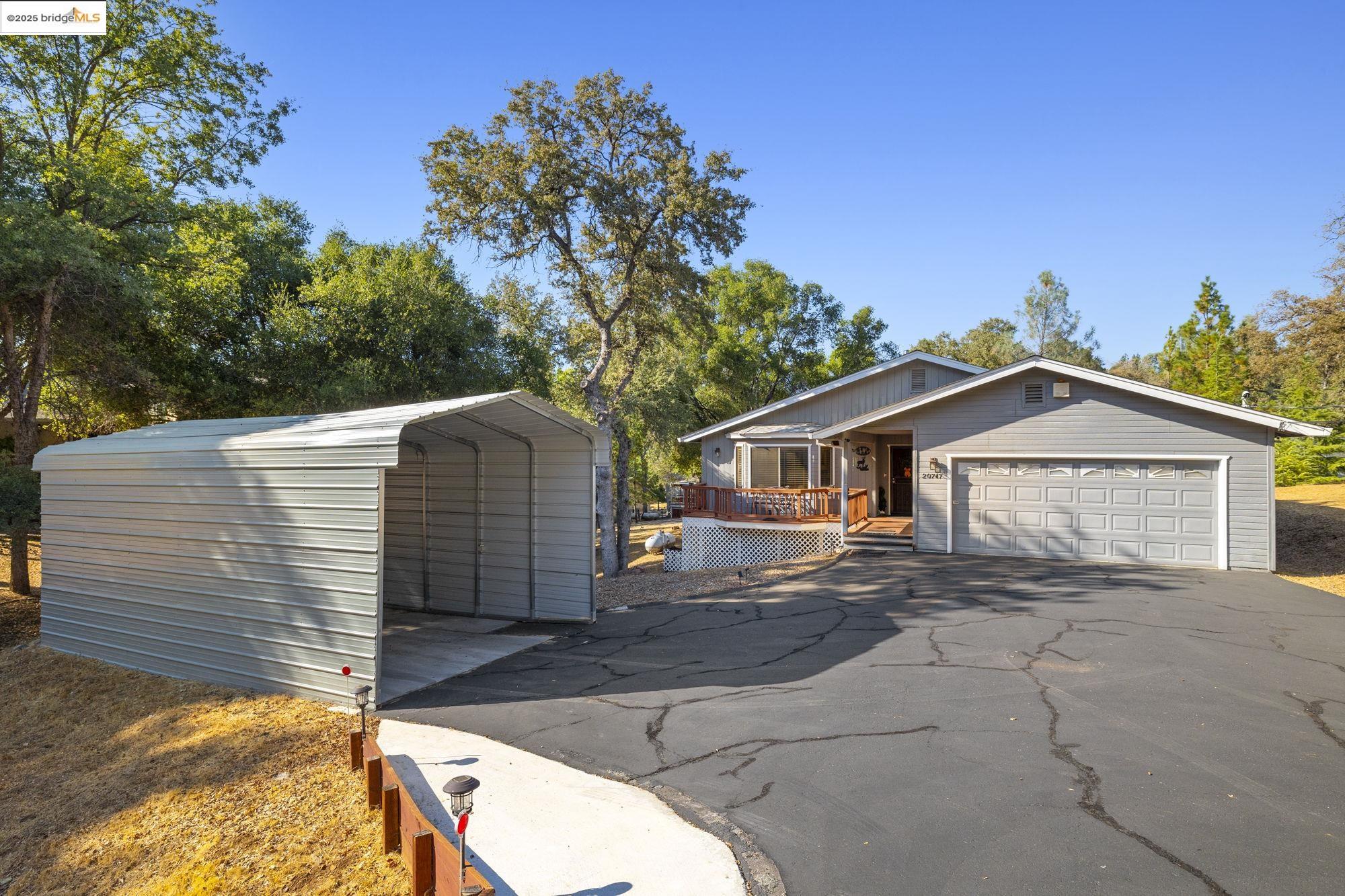 20747 Rising Hill Circle Groveland, CA 95321 - Photo 4 of 60 a view of a house with a yard