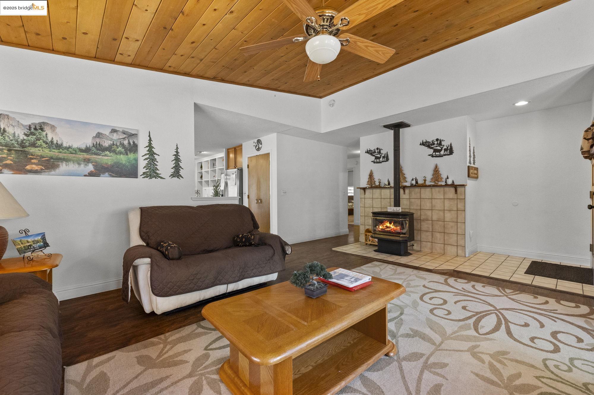 20747 Rising Hill Circle Groveland, CA 95321 - Photo 43 of 60 a living room with furniture and a flat screen tv