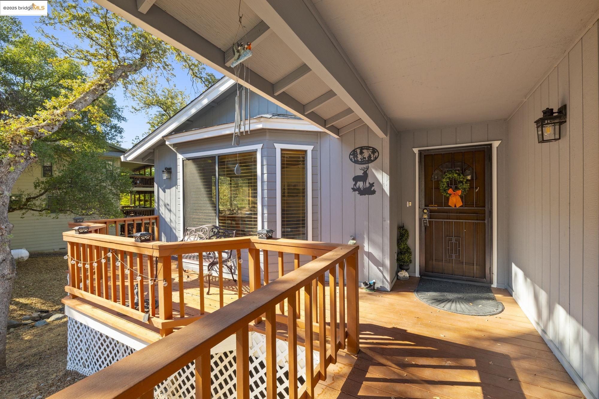 20747 Rising Hill Circle Groveland, CA 95321 - Photo 5 of 60 a view of a house with deck and furniture