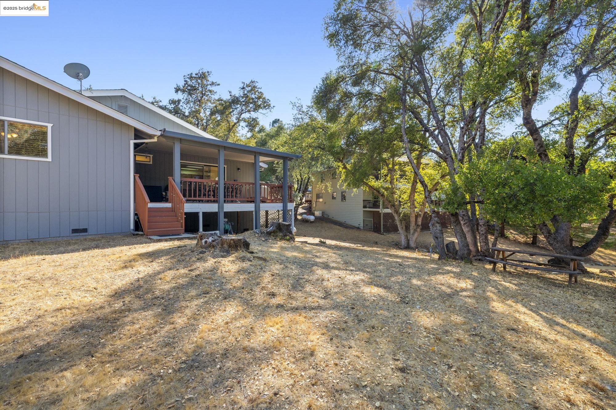20747 Rising Hill Circle Groveland, CA 95321 - Photo 60 of 60 a view of a house with a backyard and tree