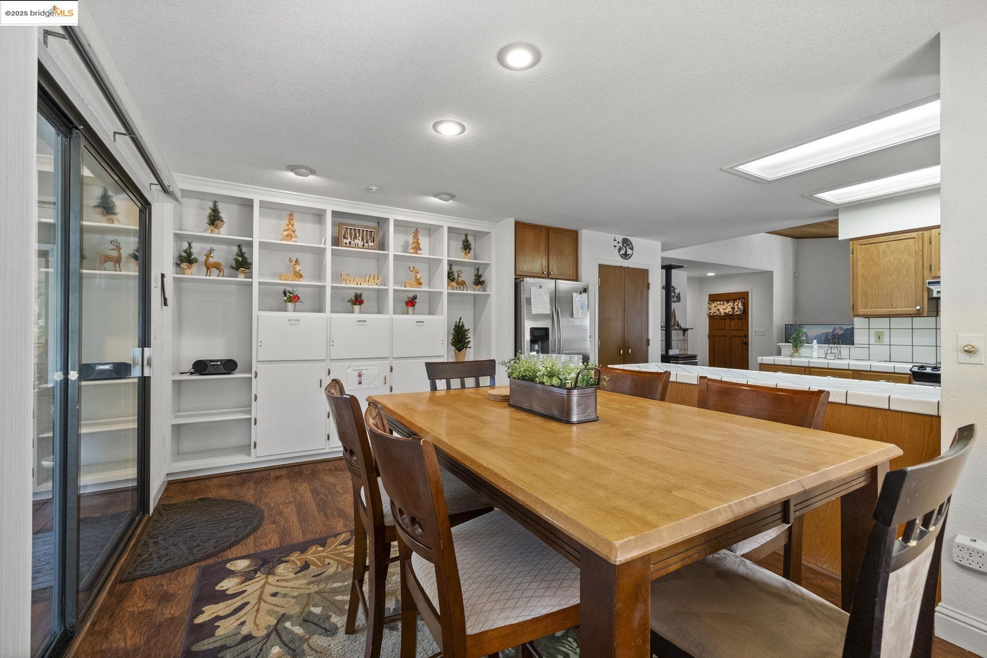 20747 Rising Hill Circle Groveland, CA 95321 - Photo 7 of 60 a view of a dining room with furniture and window