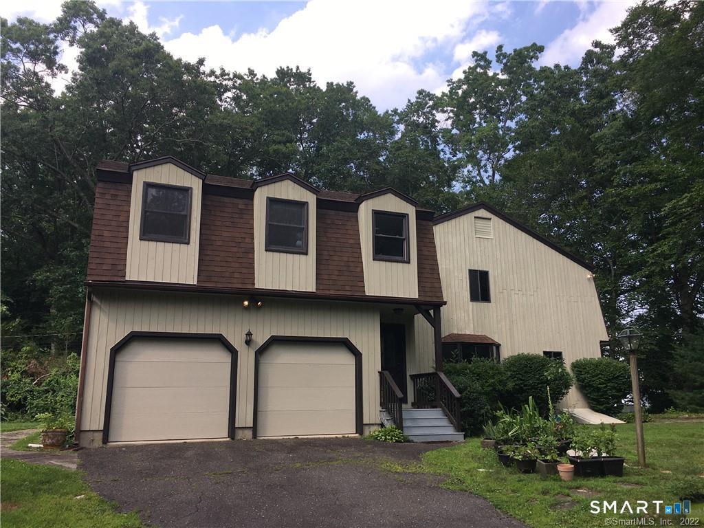 36 Lyons Plain Road Westport, CT 06880 - Photo 1 of 9 a front view of a house with garden