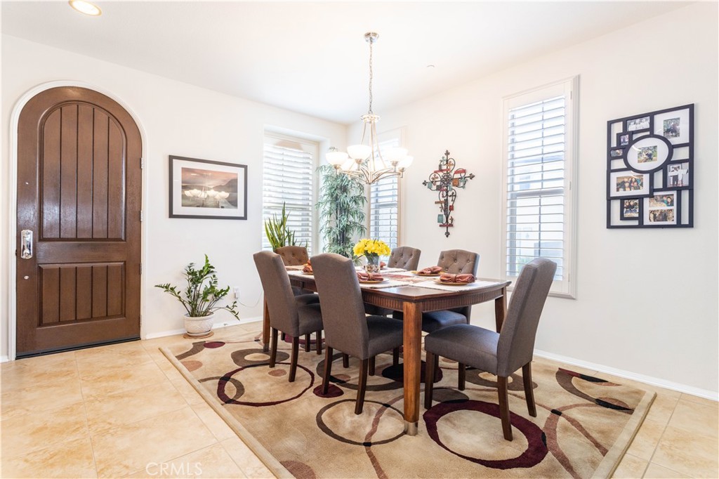 11220 Paseo Sonesta Porter Ranch, CA 91326 - Photo 12 of 46 a view of a dining room with furniture window and wooden floor