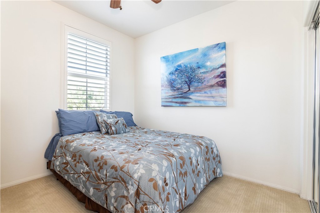 11220 Paseo Sonesta Porter Ranch, CA 91326 - Photo 20 of 46 a large bed sitting in a bedroom next to a window