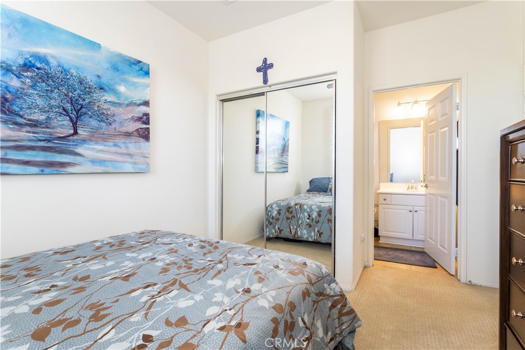 11220 Paseo Sonesta Porter Ranch, CA 91326 - Photo 21 of 46 a bedroom with a bed and a painting on the wall