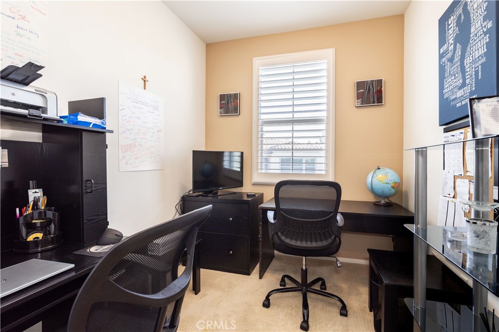 11220 Paseo Sonesta Porter Ranch, CA 91326 - Photo 23 of 46 a view of a workspace with furniture and a window