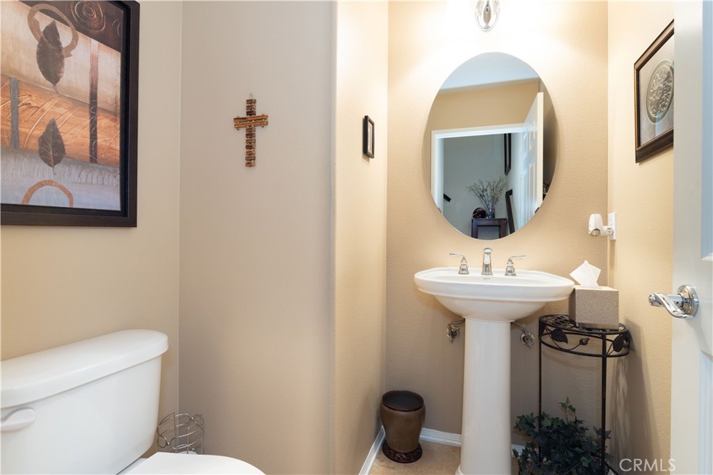 11220 Paseo Sonesta Porter Ranch, CA 91326 - Photo 25 of 46 a bathroom with a toilet sink and mirror
