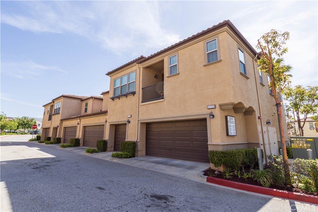11220 Paseo Sonesta Porter Ranch, CA 91326 - Photo 45 of 46 a front view of a house with a yard and garage