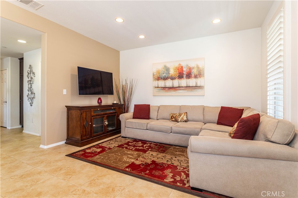 11220 Paseo Sonesta Porter Ranch, CA 91326 - Photo 8 of 46 a living room with furniture and a flat screen tv