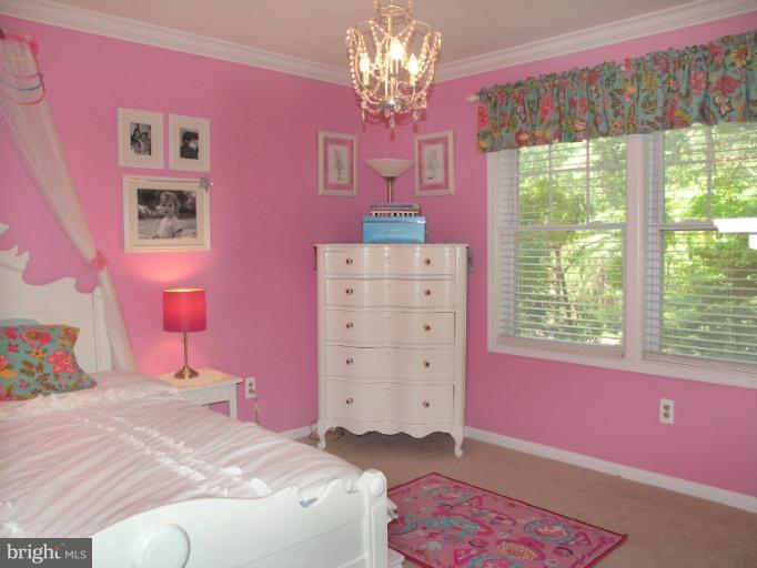 2419 Silver Fox Lane Reston, VA 20191 - Photo 12 of 30 a bedroom with a bed dresser and a window