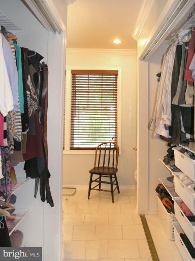 2419 Silver Fox Lane Reston, VA 20191 - Photo 19 of 30 a view of walk in closet with clothes and shoes