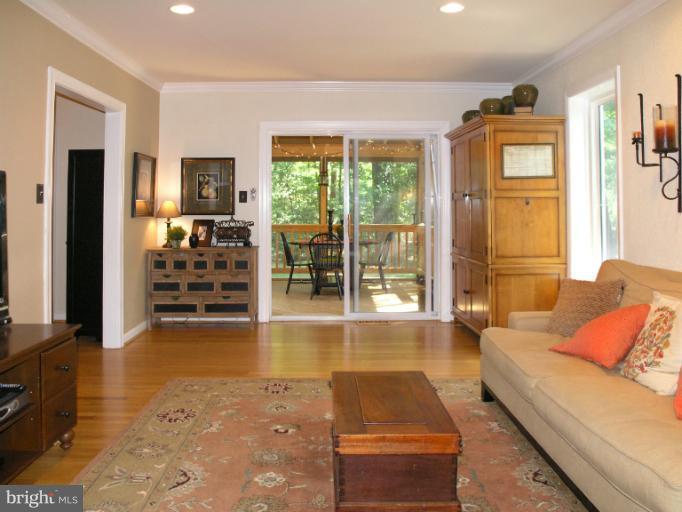 2419 Silver Fox Lane Reston, VA 20191 - Photo 20 of 30 a living room with furniture and large windows