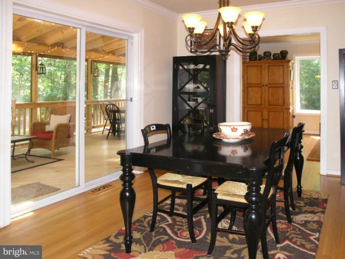 2419 Silver Fox Lane Reston, VA 20191 - Photo 24 of 30 a view of a dining room with furniture and chandelier