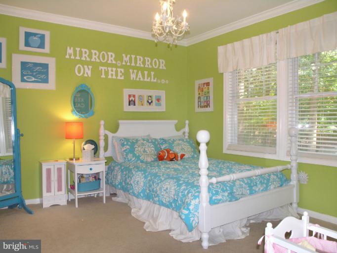 2419 Silver Fox Lane Reston, VA 20191 - Photo 26 of 30 a bedroom with a bed table and window