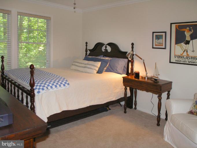 2419 Silver Fox Lane Reston, VA 20191 - Photo 30 of 30 a bedroom with a bed and a table