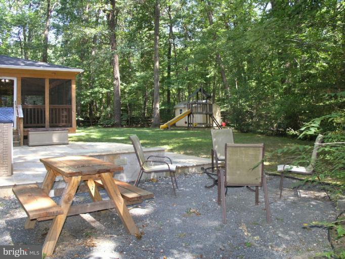 2419 Silver Fox Lane Reston, VA 20191 - Photo 6 of 30 a view of a table and chairs in backyard of the house