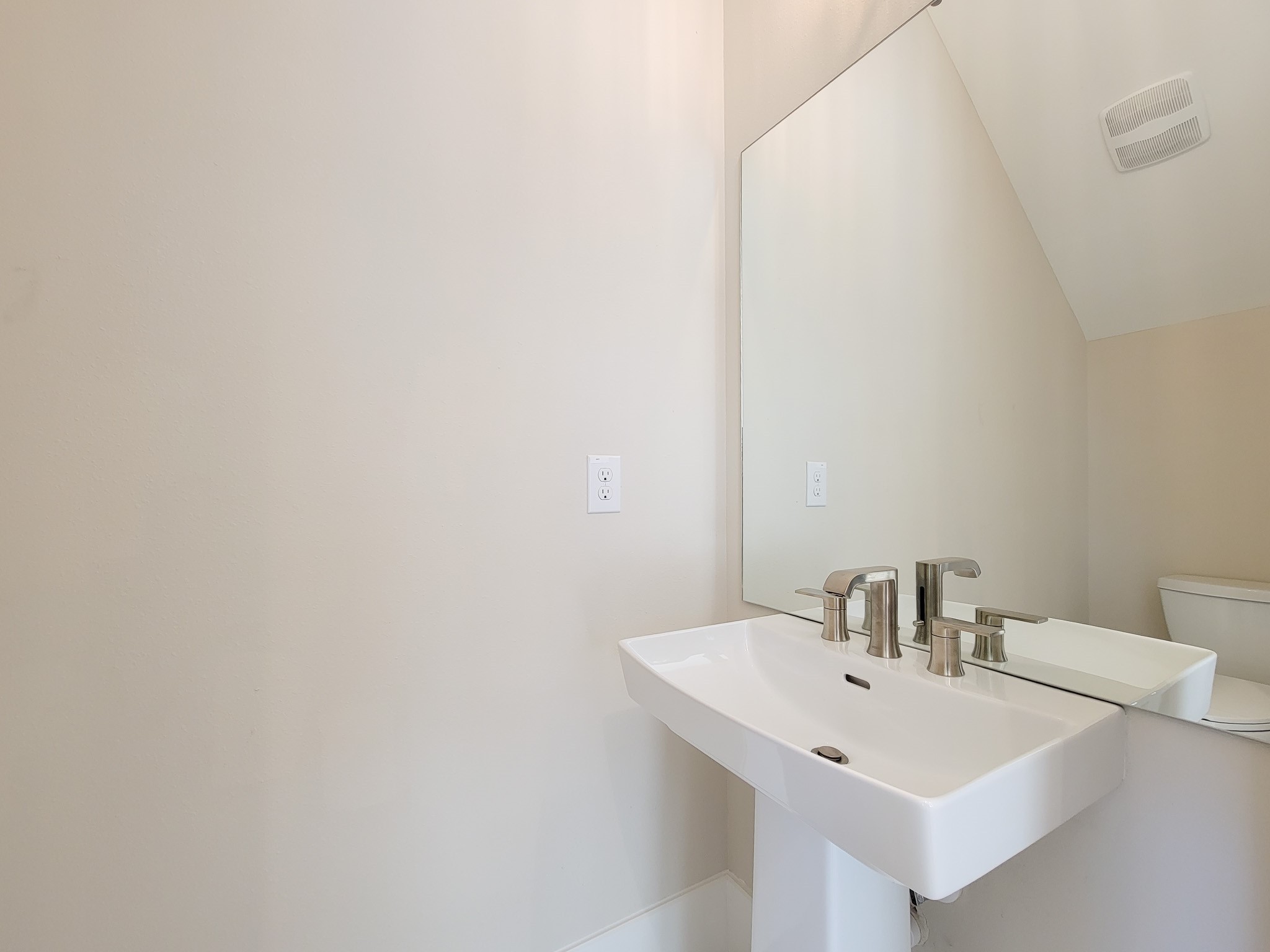 5613 Leonard Street Houston, TX 77023 - Photo 18 of 44 a bathroom with a sink and a mirror