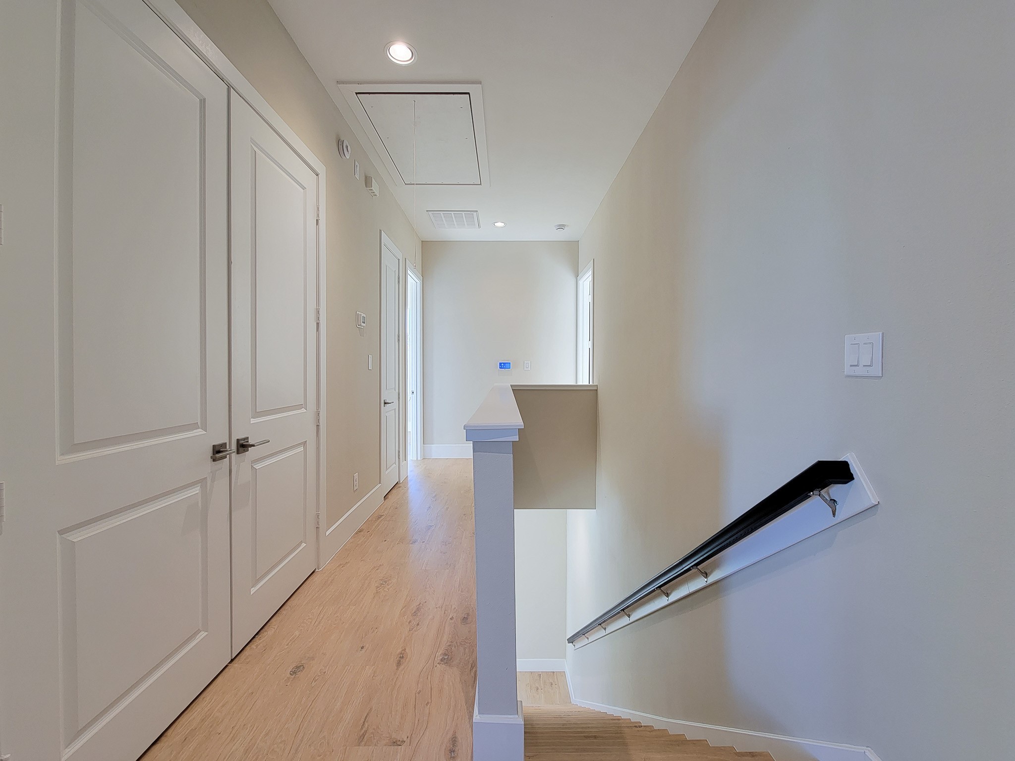 5613 Leonard Street Houston, TX 77023 - Photo 21 of 44 a view of a hallway with wooden floor