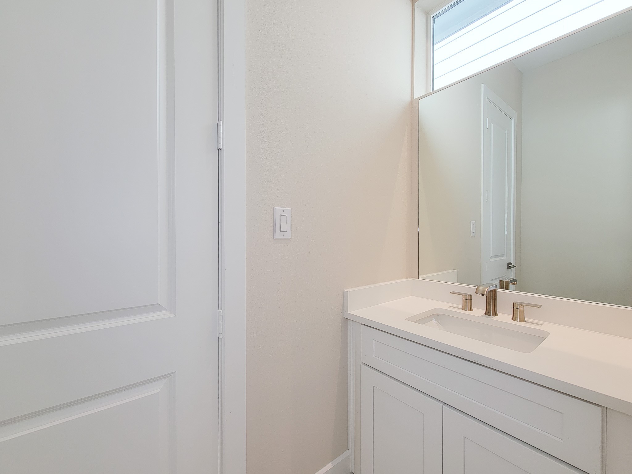5613 Leonard Street Houston, TX 77023 - Photo 25 of 44 a bathroom with a sink and a mirror