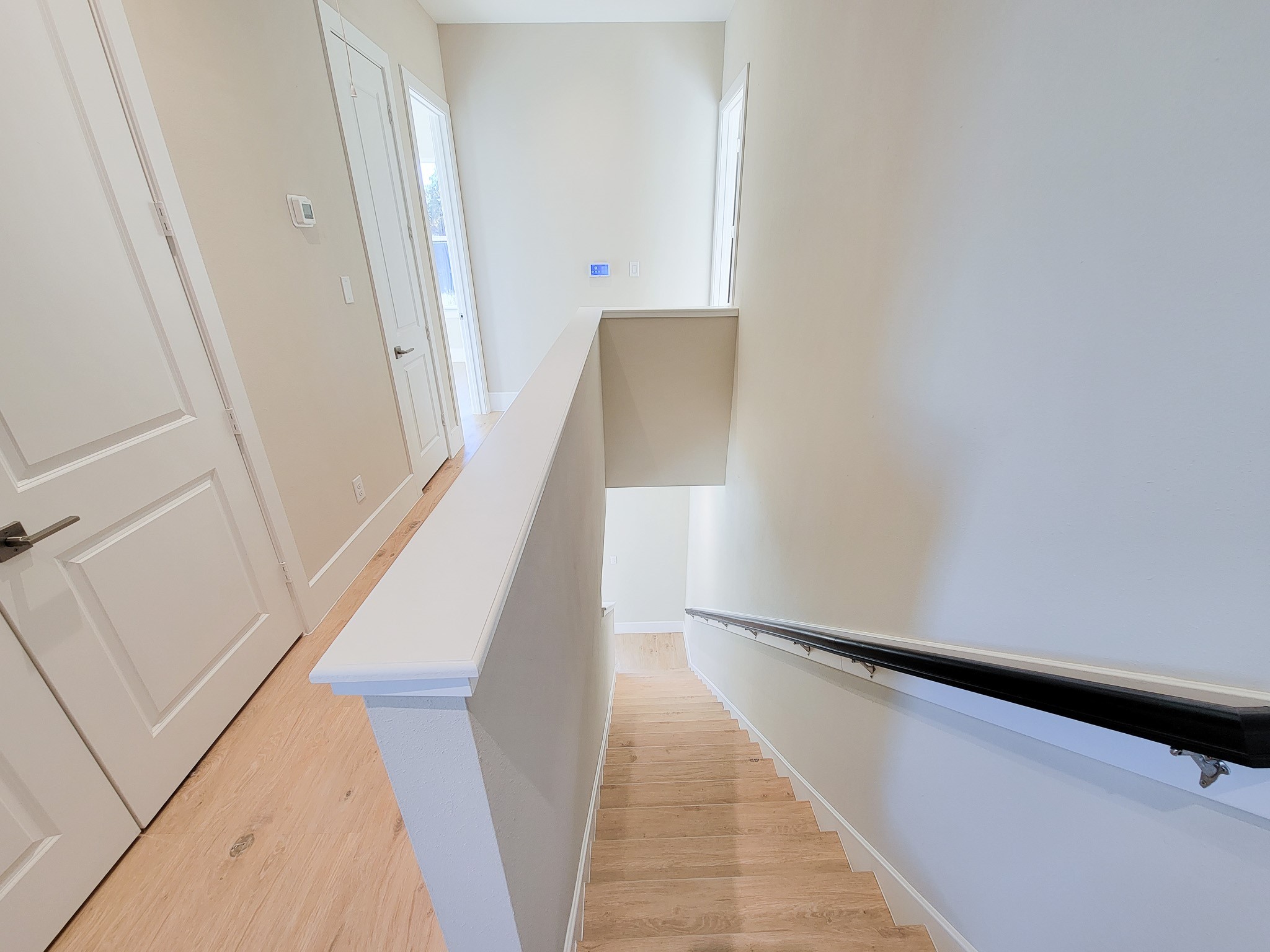 5613 Leonard Street Houston, TX 77023 - Photo 26 of 44 a view of staircase with white walls and a window