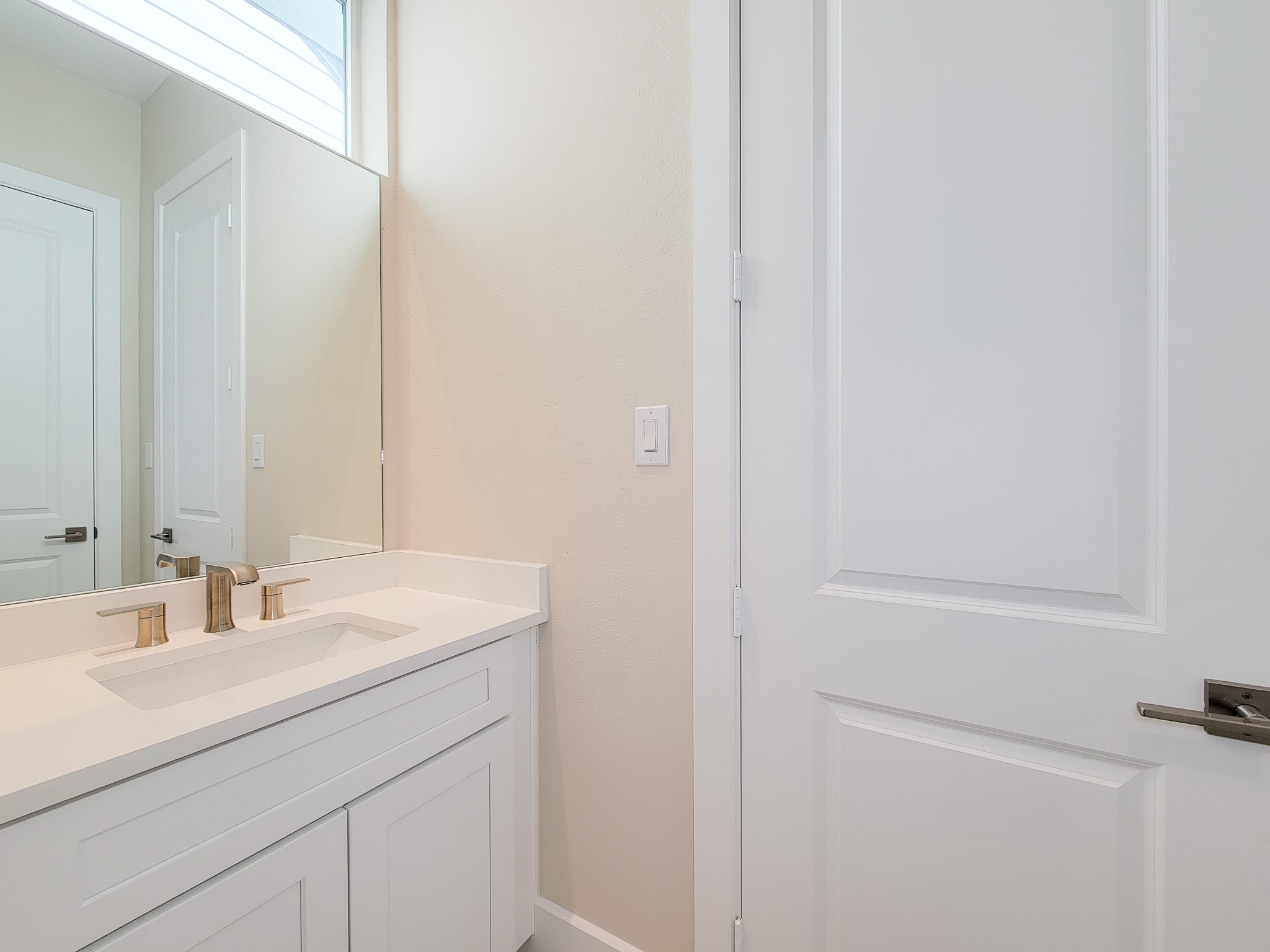 5613 Leonard Street Houston, TX 77023 - Photo 27 of 44 a bathroom with a sink and a mirror