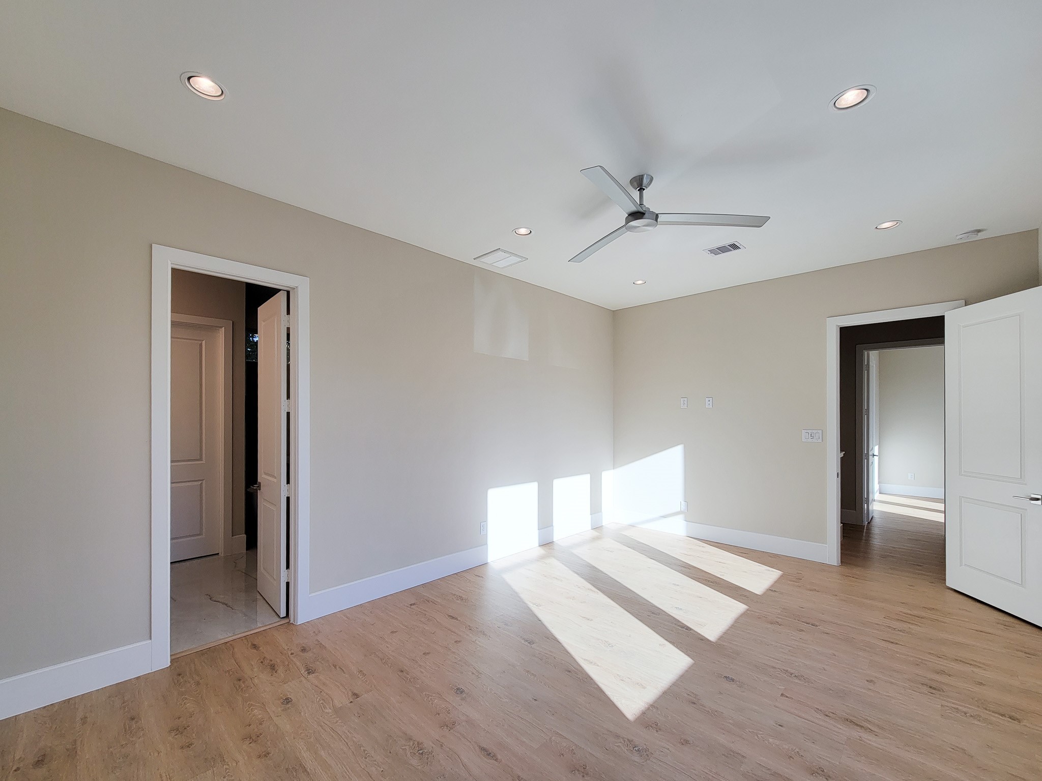 5613 Leonard Street Houston, TX 77023 - Photo 32 of 44 wooden floor in an empty room with a window