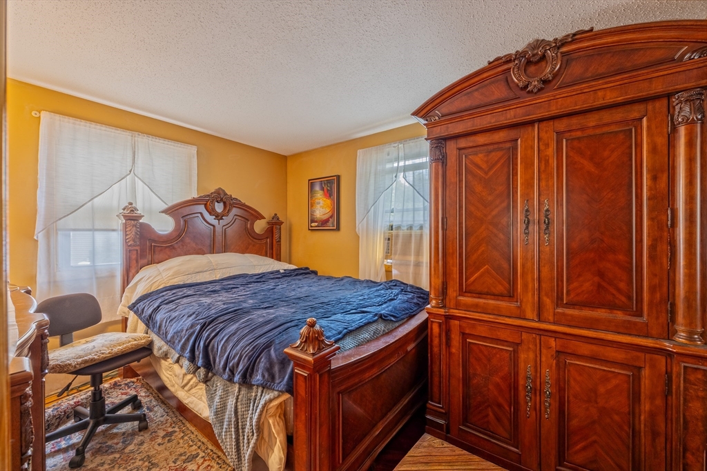 60 Elizabeth Street Feeding Hills, MA 01030 - Photo 12 of 39 a bedroom with a bed and a window