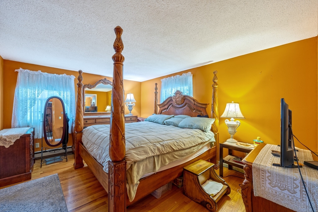 60 Elizabeth Street Feeding Hills, MA 01030 - Photo 13 of 39 a bedroom with a bed and wooden floor