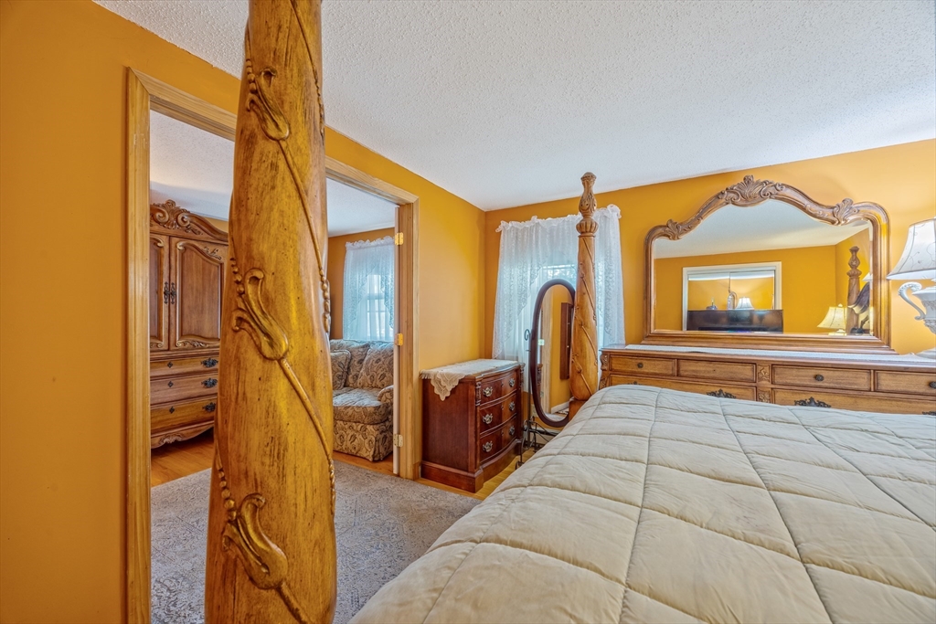 60 Elizabeth Street Feeding Hills, MA 01030 - Photo 14 of 39 a en suite bathroom with a tub and mirror