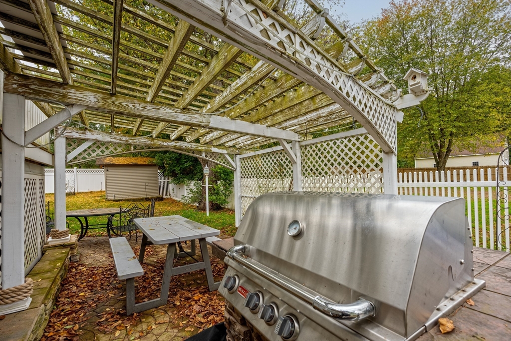 60 Elizabeth Street Feeding Hills, MA 01030 - Photo 28 of 39 a view of a chairs and table in the back yard of the house