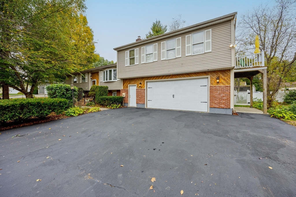 60 Elizabeth Street Feeding Hills, MA 01030 - Photo 33 of 39 a front view of a house with garden