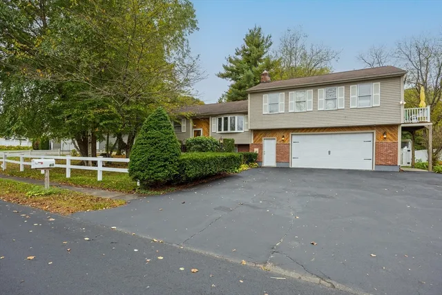 a view of a house with a backyard