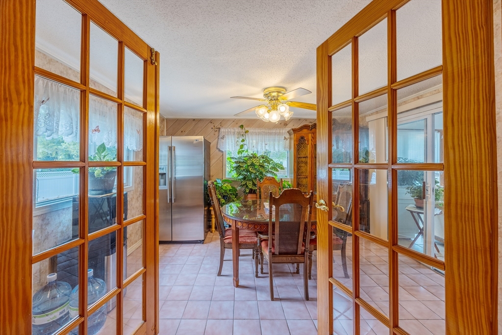 60 Elizabeth Street Feeding Hills, MA 01030 - Photo 9 of 39 a dining room with furniture and floor to ceiling windows