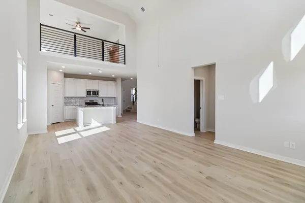 a kitchen with stainless steel appliances granite countertop a stove top oven a sink a counter space and cabinets