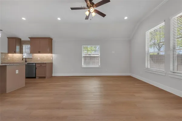 a view of a kitchen with stove and cabinets