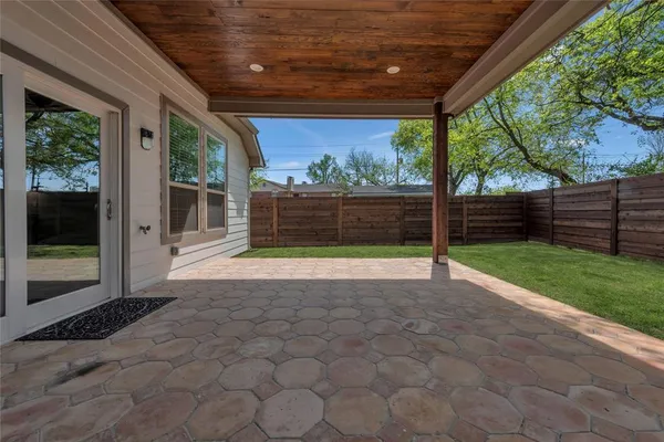 a view of backyard with green space