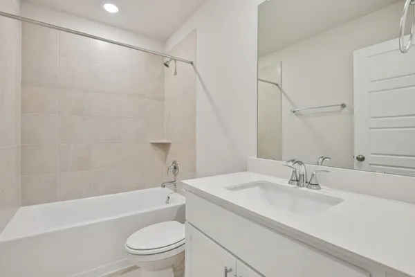 a bathroom with a sink a toilet and a bathtub