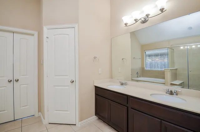 a white bath tub sitting next to a shower
