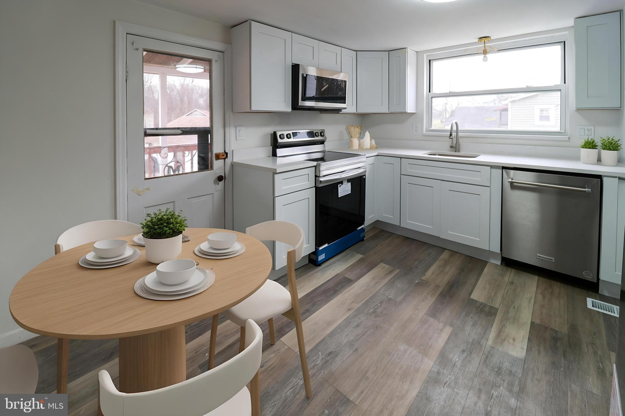 495 York Haven Road York Haven, PA 17370 - Photo 13 of 58 a kitchen with stainless steel appliances granite countertop a sink a stove a dining table and chairs