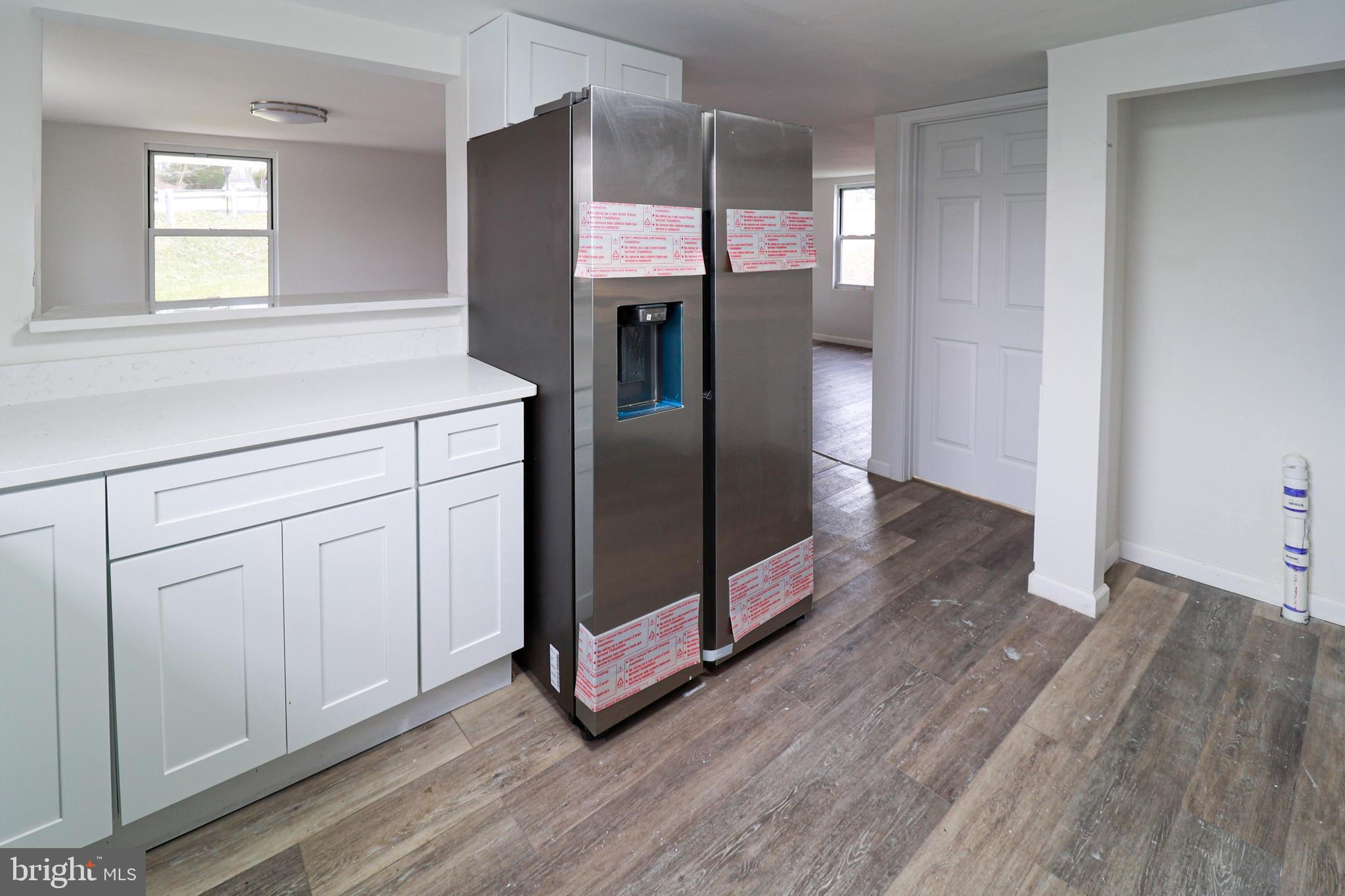 495 York Haven Road York Haven, PA 17370 - Photo 16 of 58 a kitchen with white cabinets and wooden floor