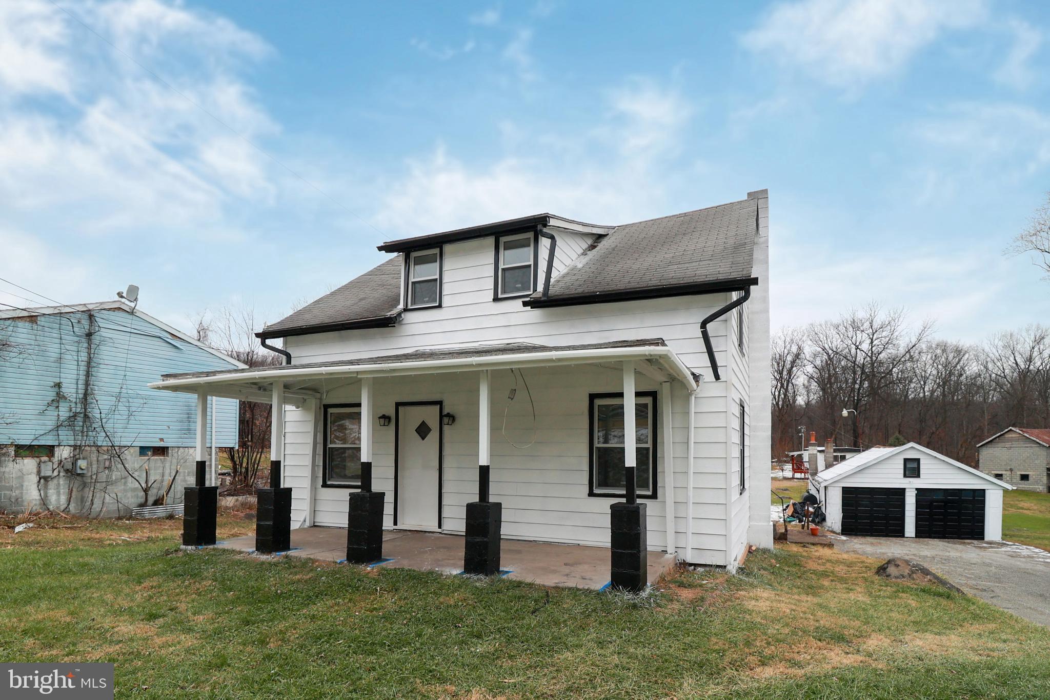 495 York Haven Road York Haven, PA 17370 - Photo 3 of 58 a front view of a house with a yard