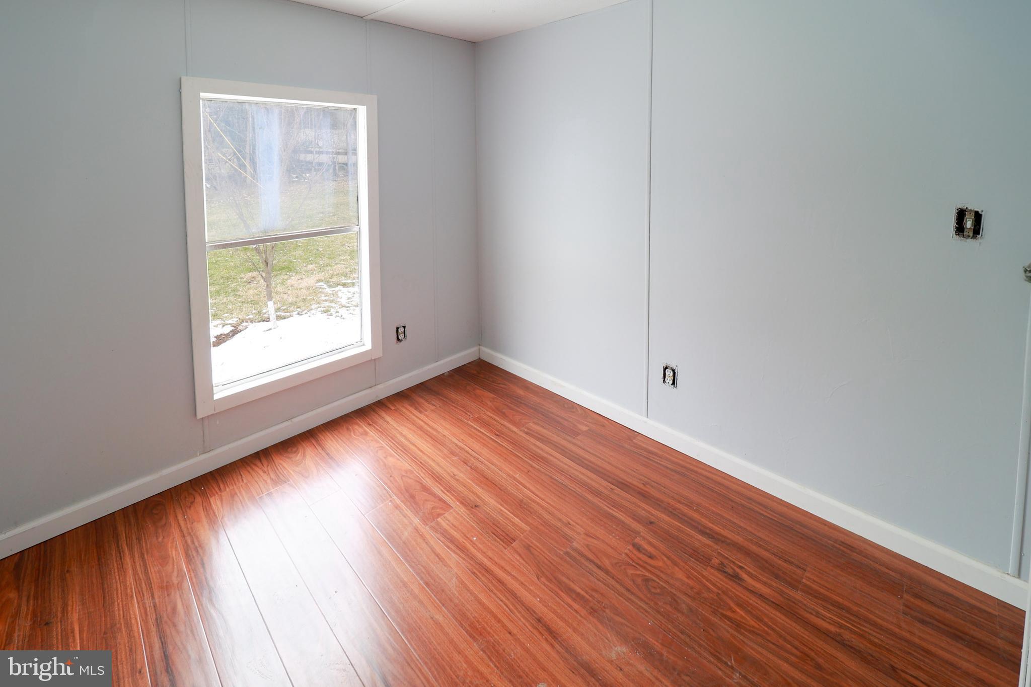 495 York Haven Road York Haven, PA 17370 - Photo 51 of 58 an empty room with wooden floor and windows