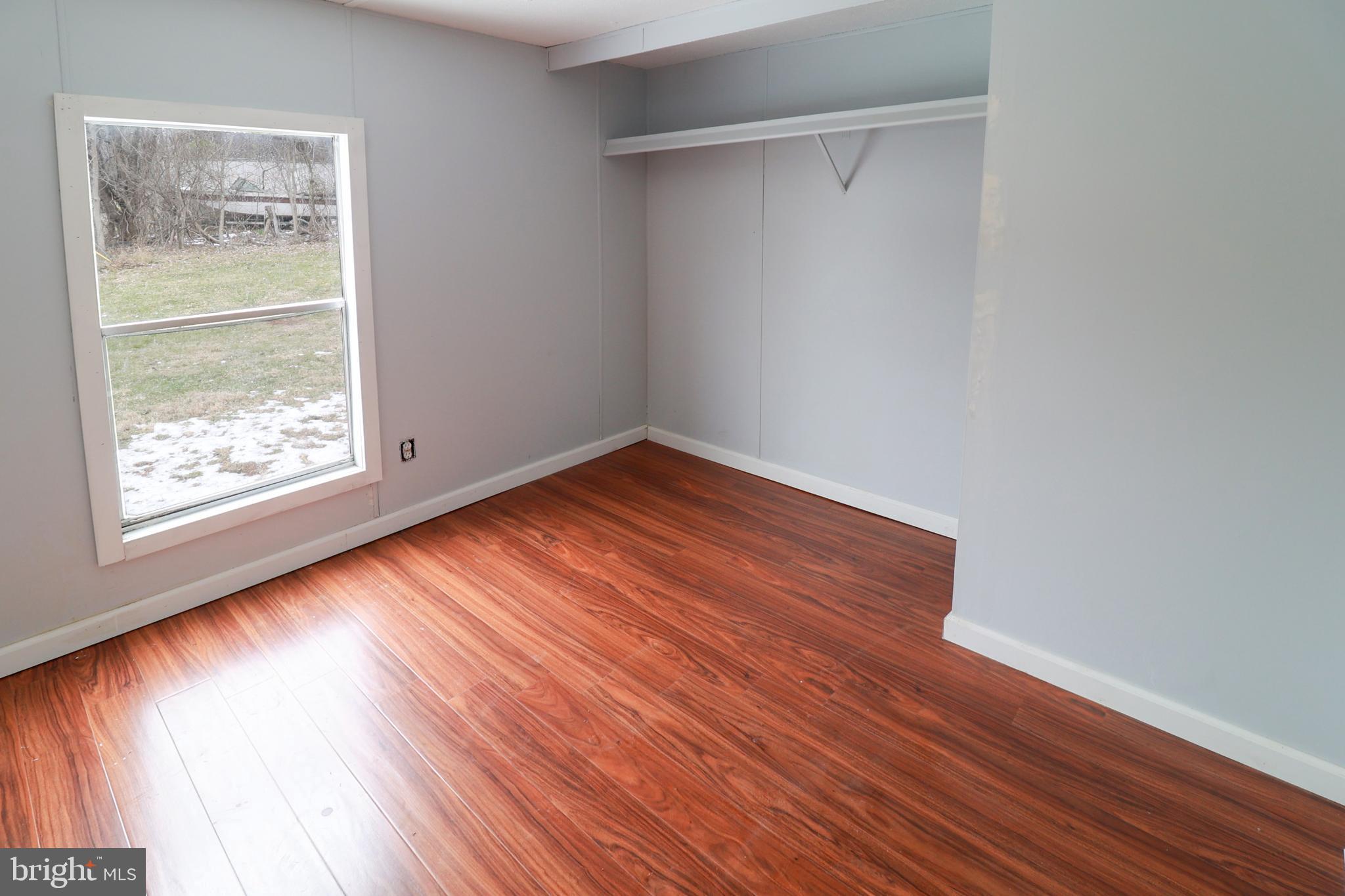 495 York Haven Road York Haven, PA 17370 - Photo 52 of 58 an empty room with wooden floor and windows