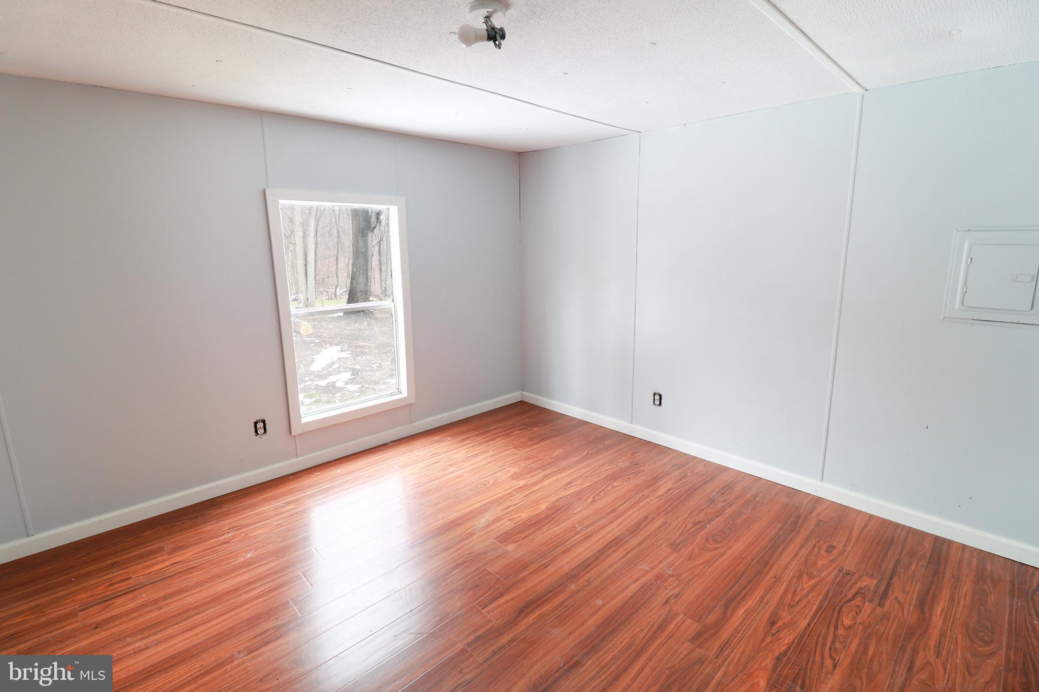 495 York Haven Road York Haven, PA 17370 - Photo 56 of 58 a view of an empty room with wooden floor and a window